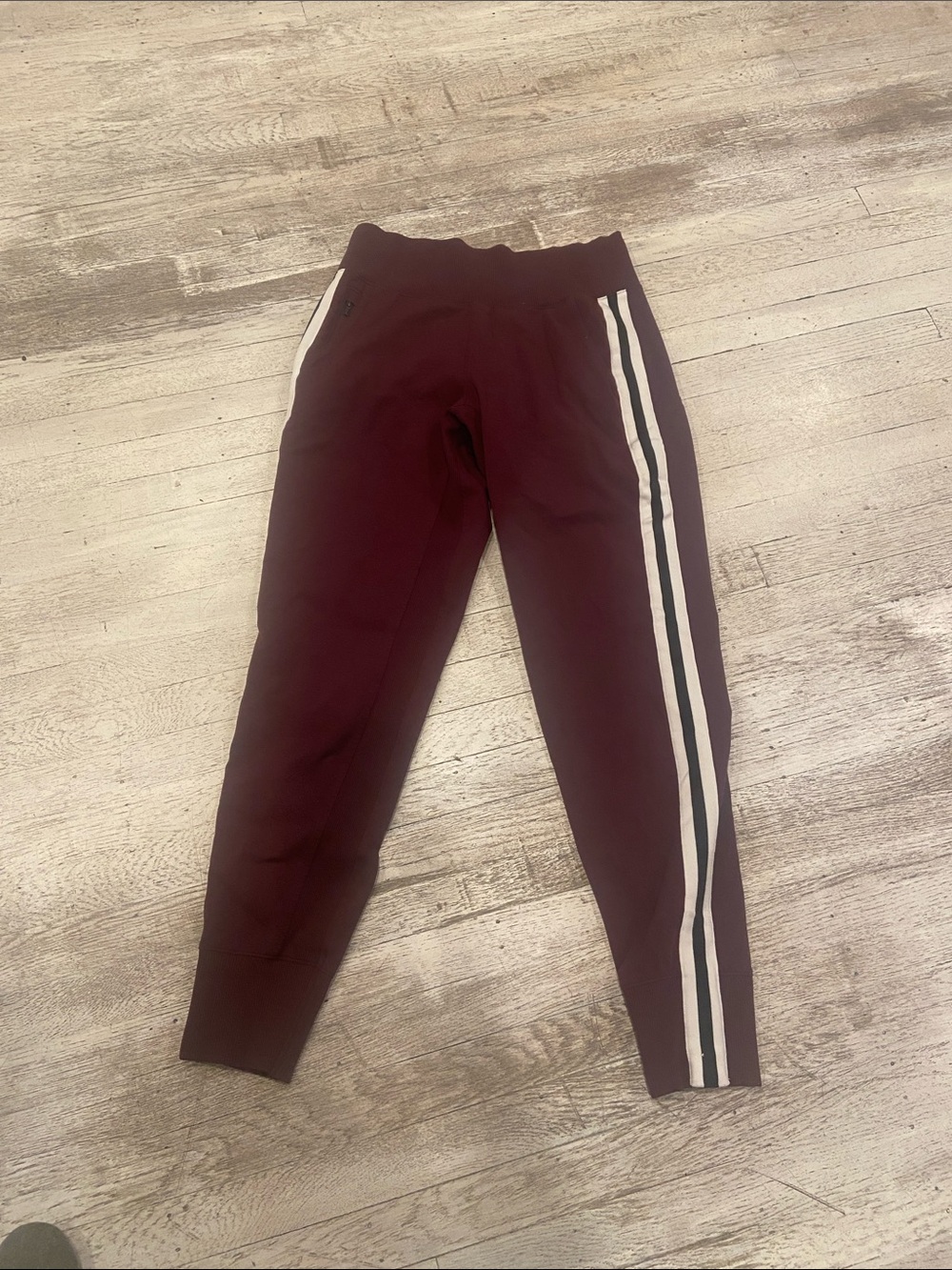 Athleta Maroon ladies Joggers with White Side Stripes guc size medium